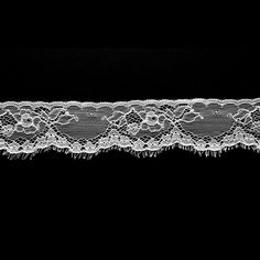 a white lace on a black background