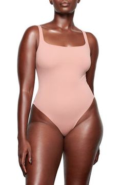 Sculpt your body's natural shape with a sleeveless bodysuit from Kim Kardashian West's SKIMS that holds you in and lifts you up in all the right places. Reflecting the brand's passion for highly technical shapewear solutions for every body, this everyday piece has a whisper-soft, seamless construction, high-cut legs and thong back that remains invisible under clothing. Square neck Sleeveless Lined 76% polyamide, 24% elastane Machine wash, tumble dry Imported Women's Clothing High Neck Bodysuit, Square Neck Bodysuit, Sleeveless Bodysuit, Cute Summer Outfits, Everyday Wardrobe, High Cut, Base Layer, Everyday Style, Square Neck