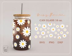 a mason jar filled with brown and white daisies next to a sticker that says, daisy flower can glass 16oz