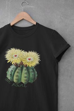 "Who doesn't love a good cactus pun shirt? This pretty vintage-inspired cactus design evokes antiquarian bookplate artwork. But you'll get a sarcastic yet whimsical prick (pun intended) from the green script text \"on point\" that curves around the base of the flowering cactus plant.  This makes an ideal gift for botanists and plant parents, naturalists and nature nerds.  The five color choices are all carefully selected to be a pretty and flirty compliment to the design colors and overall aesthetic. Choose from light blue, pink, white, yellow, heather peach, heather ice blue or heather mauve to suit your personal style.  This updated unisex essential fits like a well-loved favorite. There's a lot to love about the super soft cotton and excellent quality of the print. .: 100% Soft cotton ( Cactus Pun, Flowering Cactus, Pun Shirts, Script Text, Botanical Shirt, Cactus Design, Cactus Plant, Funny Vintage, Pretty Colors