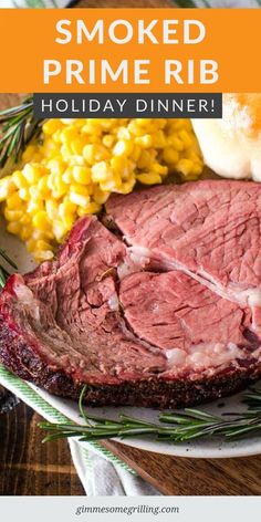 a plate with corn and meat on it that says, smoked prime rib holiday dinner