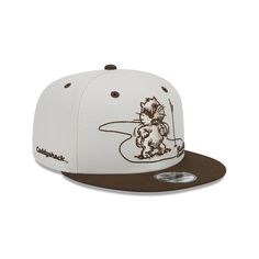 a white and brown hat with an image of a cat sitting on top of it