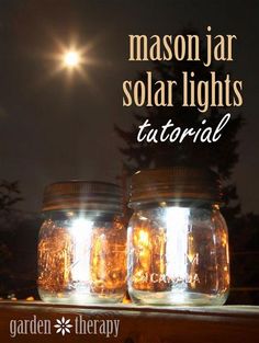 mason jar solar lights sitting on top of a wooden table with the words mason jar solar lights