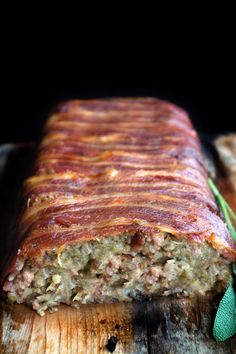 a meatloaf is cut into pieces on a cutting board