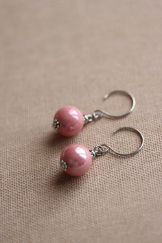 Lovely elegant everyday earrings with pink ceramic 12 mm beads,steel connectors and stainless steel earring hooks. Earring hooks are from nickel and lead free metal. *The total lenght of earrings is about 38 mm including the earring hooks. Other earrings of my shop you can see here: https://www.etsy.com/shop/NaTavelli?section_id=13757927 Thank you for visit! Elegant Pink Beaded Hypoallergenic Earrings, Elegant Pink Hypoallergenic Beaded Earrings, Elegant Pink Teardrop Beaded Earrings, Elegant Pink Pearl Drop Beaded Earrings, Pink Adjustable Pearl Drop Earrings, Delicate Nickel-free Pink Earrings, Adjustable Pink Pearl Drop Earrings, Pink Round Pearl Earrings With Ear Wire, Pink Pearl Earrings With Round Ear Wire