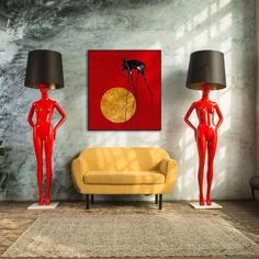 a living room filled with furniture and a painting on the wall above it's two mannequins