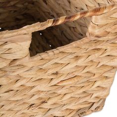 a close up of a basket that is made out of wicker and has a handle