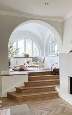 a living room filled with furniture and a fire place