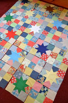 a patchwork quilt is laying on the floor