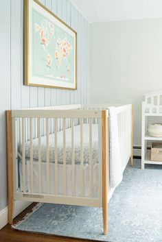 a baby's crib in the corner of a room