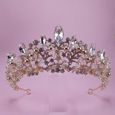 Introducing Katrina our custom Gold Quinceanera Tiara - perfect for your special event! Whether it's your big day as a bride, a Quinceanera, or a pageant, this Gold bridal tiara will be the crowning glory of your outfit. Crafted with exquisite attention to detail and Gold and clear stone, clear and gold crystals, beads it's sure to add a hint of royalty to your look. Katrina Gold Quinceanera Tiara Details: 2 1/2" High. Gold Tiara, Gold beads and crystals. I can customize anything you would like Gold Quinceanera Crown, Gold Bridal Tiara, Gold Quinceanera, Gold Bridal Crowns, Quinceanera Tiaras, Quinceanera Crown, Tiara Gold, Gold Crystals, Crystals Beads