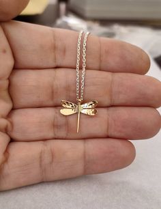 Dragonfly necklace with 18 Kt gold pendant and sterling silver chain. The dragonfly has a width of 2 cm and a height of 1.6 cm, the finish is glossy. Made in Italy. Design by Calcagnini Gioielli. All the jewels I make are shipped inside a beautiful gift box. To see more, please visit my shop at: https://www.etsy.com/it/shop/calcagninigioielli Handmade Gold Dragonfly Jewelry, Gold Dragonfly Necklace For Gift, Adjustable Dragonfly Necklace For Gifting, Dragon Fly Jewelry Gold, Nickel-free Gold Dragonfly Jewelry, Dragonfly Necklace, Italy Design, Beautiful Gift Boxes, Sterling Silver Chain