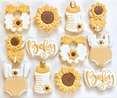 baby shower cookies decorated with sunflowers, diapers and ones for the babies