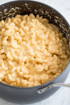 macaroni and cheese is being cooked in a pot