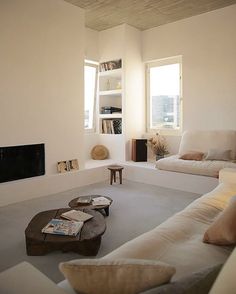 a living room filled with furniture and a fire place