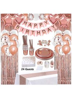 a birthday party set up with pink and gold balloons, streamers, plates, napkins