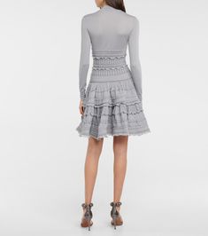 Lace wool-blend dress in grey - Alaia | Mytheresa Elegant Crochet Dress With Pointelle Knit, Fitted Long Sleeve Crochet Dress With Lace Trim, Elegant Winter Mini Dress With Lace Trim, Chic Fitted Dress With Pointelle Knit, Elegant Fitted Crochet Dress With Pointelle Knit, Chic Fitted Pointelle Knit Dress, Fitted Lace Dress With Ruffles For Fall, Elegant Long Sleeve Crochet Dress For Fall, Elegant Mini Length Crochet Dress With Ruffles