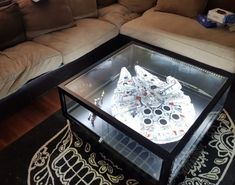 a coffee table with a star wars millennium model on it