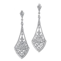 These top-selling Mariell bridal earrings are what make vintage wedding jewelry so popular! They boast a jewel-encrusted flare design rich in cubic zirconia inlaid stones. These dramatic 14 K gold, silver, or rose gold rhodium plated earrings measure 2 3/4" for an eye-catching wedding accessory. These beautiful earrings are great for mothers of the groom, mothers of the bride, and bridesmaids as well. Rich Earrings, Cubic Zirconia Bridal Earrings, Wedding Earrings Chandelier, Silver Bridal Earrings, Vintage Wedding Jewelry, Dangle Earrings Wedding, Spanish Wedding, Dramatic Classic, Earrings Chandelier