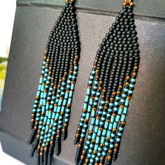 Blue Turquoise ,Matt Black and bronze color combination.Long tassel earrings. Beaded earrings. native American style .Fringe earrings .Seed Bead Earrings .Boho earrings . Materials;Sterling silver ear wire. High quality japanese beads 3 shades. This bead does not lose its color and does not darken. Earrings length 4.5 inches (11cm) You can see a large selection of earrings on my page https://www.etsy.com/il-en/shop/JewelryByElenaZar?ref=seller-platform-mcnav§ion_id=25458740 Black Beaded Tassel Earrings, Black Bohemian Long Drop Beaded Earrings, Black Tassel Drop Earrings With Colorful Beads, Black Tassel Earrings With Colorful Beads For Gift, Black Bohemian Long Drop Earrings, Black Bohemian Dangle Tassel Earrings, Bohemian Black Tassel Earrings As Gift, Bohemian Tassel Earrings With Black Beads For Gift, Bohemian Black Tassel Earrings With Dangling Beads