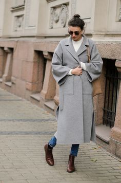 Light gray wool coat is designed with its oversized fit and lowered shoulders line. The notch collar adds a touch of sophistication, while the two patch pockets offer both style and functionality. With two side slits for ease of movement, this coat is as practical as it is stylish. Complete with a belt for, this long oversize wool coat is the perfect addition to your winter wardrobe.  Coat fabric: 100% wool Lining: 100% viscose SIZE All our clothes are made to order, so please allow 5 - 7 busine Light Grey Coat Outfit, Grey Coat Outfit, Camel Coat Outfit Classy, Grey Coats, Wool Coat Outfit, Camel Coat Outfit, Grey Overcoat, Oversized Wool Coat, Mode Mantel