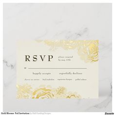 a white and gold wedding rsvp card with roses on the front is shown