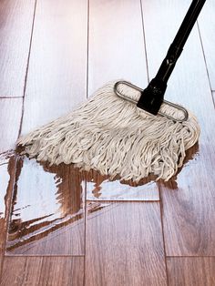 a mop is laying on the floor with it's handle