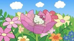 a hello kitty sitting on top of a pink flower in a field with flowers around it