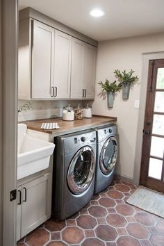 a washer and dryer in a small room