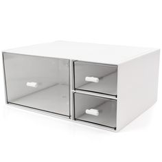 an empty white box with two drawers on the front and one drawer open to show something