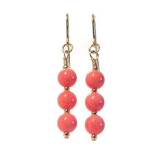 9ct gold pink coral earrings Details: - pink coral beads are 6mm in diameter - 9ct gold beads are 2mm in size - hook earrings are also 9ct gold - total length of the earrings are 40mm These gorgeous 9ct gold earrings feature coral gemstone beads set securely with gold beads that compliment them beautifully.  The pink coral beads are really prominent and they shout out elegance, as that is what this creation is, elegant.  Coral has been highly prized as a gemstone and is believed to be endowed with mysterious, powerful and sacred properties. *Free Complimentary Gift Box* Your jewellery will arrive in a beautiful gift box, carefully packaged for a safe arrival and ready for gifting to a loved one or to yourself. You may be interested in our other Coral jewellery here: https://www.etsy.com/uk Coral Jewelry With Dangling Beads For Gift, 9ct Gold Earrings, Coral Gemstone, Gold Earrings For Women, Daughter Mother, Earring Gift, Coral Earrings, Coral Jewelry, Pink Coral