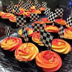 cupcakes decorated with racing flags and checkered flags