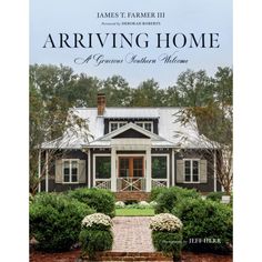 the front cover of an architectural book showing a house with white trim and brick steps leading up to it