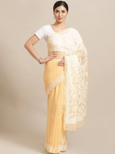 "Find more items of ADA:- https://www.etsy.com/in-en/shop/AdachikanStudio SKU: A204484 Fabric: Faux Georgette Length of the Saree: 5.50 meter Blouse Fabric: 1 meter Color: Carrot Pink Embroidery: Bakhiya , Keelkangan and Jaali Thread: White Cotton Touch and Feel: Soft and Comfortable Silhouette: Feel elegant with Ada Chikankari saree. The alluring Peach Faux Georgette saree weaved with white cotton thread. The fabric is lightweight and soft, best for any season use. Disclaimer: Blouse Shown for Georgette Sets With Sheer Dupatta For Puja, Semi-stitched Lace Saree With Sheer Dupatta, Puja Set With Sheer Dupatta In Georgette, Pre-draped Saree For Eid, Self Design Pre-draped Saree For Eid, Eid Pre-draped Saree With Self Design, Self-design Pre-draped Saree For Eid, Festive Chikankari Embroidery Art Silk Blouse, Festive Yellow Choli With Chikankari Embroidery