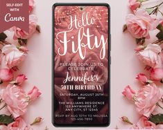 a cell phone sitting on top of a table with pink flowers around it and the words hello