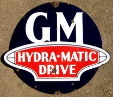 the gm logo is on the side of a cement block that says,'hydra - matic drive '