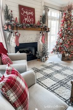 a living room decorated for christmas with red and white decorations