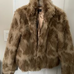 Tan Faux Fur Multi Shade Lined Jacket. Brand New With Tags. Hook And Eye Closure. Trendy Beige Faux Fur Outerwear, Brown Faux Fur Outerwear For Spring, Spring Brown Faux Fur Outerwear, Trendy Brown Faux Fur Outerwear, Dark Green Coat, Grey Pea Coat, Faux Leather Coat, Camouflage Jacket, Tan Jacket