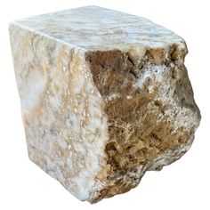 a white and brown stone block on a white background