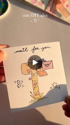 someone holding up a card with a giraffe on it and the words, cute diy idea