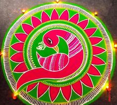 an intricately decorated rang art work with lights on the floor in front of it