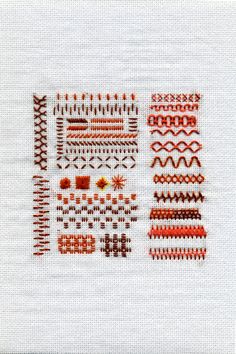 the cross stitch pattern is in red and white