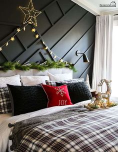 a bedroom decorated in black and white with christmas decorations