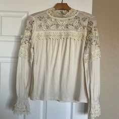 Anthropologie Shirt New With Tags. Size Xs Spring Crew Neck Top For Brunch, Crew Neck Top For Spring Brunch, Spring Brunch Crew Neck Top, Beige Crew Neck Blouse For Spring, Beige Lace Trim Tops For Fall, Lace Top Long Sleeve For Brunch, Fall Cotton Tops With Lace Trim, Long Sleeve Tops With Lace Trim For Brunch, Long Sleeve Top With Lace Trim For Brunch