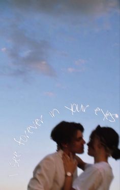 a man and woman standing next to each other under a blue sky with the words never in your eyes written on it