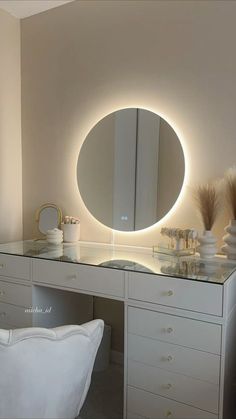 there is a vanity with a lighted mirror on it