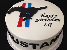 a birthday cake with an image of a mustang on it