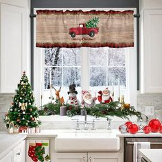 a kitchen decorated for christmas with santa clause and reindeers on the window sill