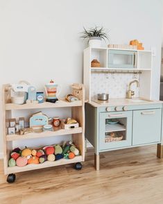 a toy kitchen and play set in a child's room