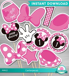 minnie mouse cupcake toppers with pink and white polka dots on the cake sticks